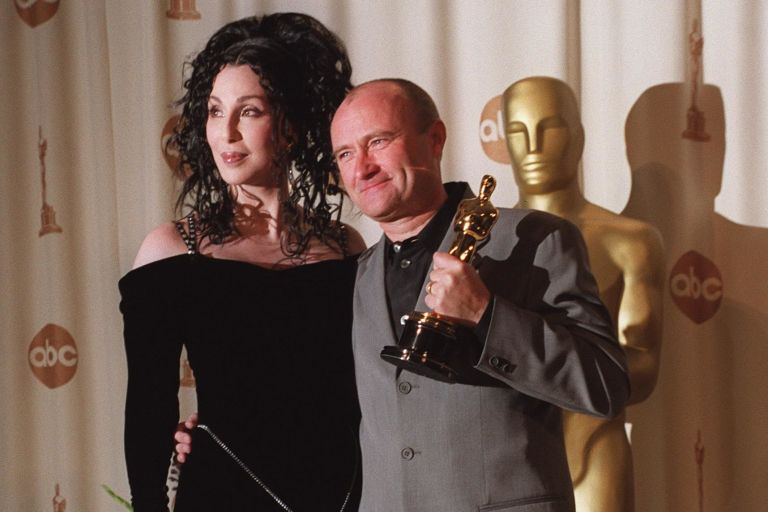Phil Collins and Cher backstage at the 72nd Academy Awards