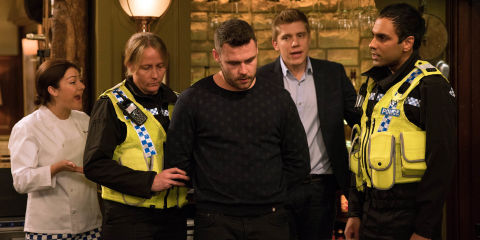EMBARGO 10/1 Aaron is taken away by the police in Emmerdale